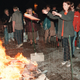 Members of the Harvest Assembly of God Church congregation toss items like books and CDs into a fire in 2001.